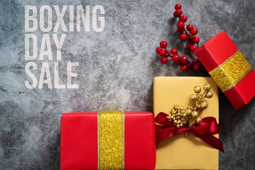 Boxing day Sale concept Christmas gift box on cement background, top view
