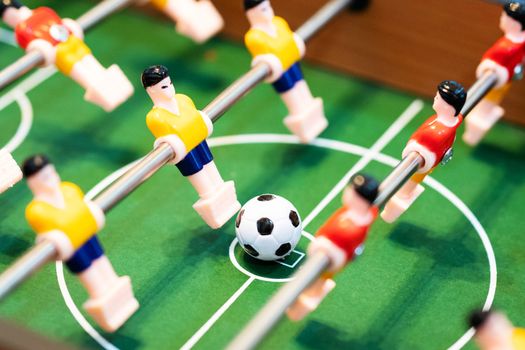 Foosball table soccer. football player, sport concept