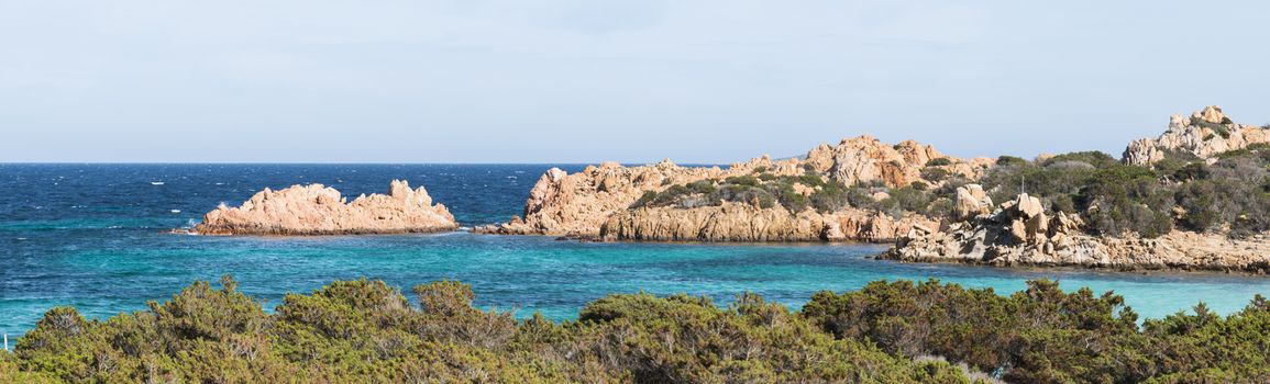 bay with blue water onm ths island of maddalena, you reach the island with the ferry from palu on sardinia