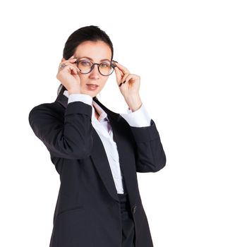 Business women in black suits hold glasses with both hands While looking ahead. Portrait on white background with studio light.
