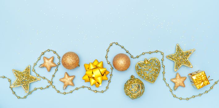 Gift box or present box with golden star and ball on blue background for birthday, christmas or wedding ceremony