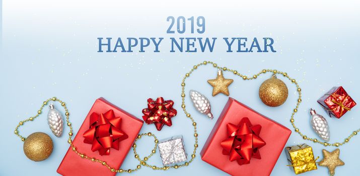 2019 Happy New Year concept, gifts boxes or presents boxes with red bows, star and ball on blue background