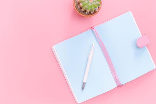 workspace desk styled design office supplies with cactus on pink pastel background minimal style