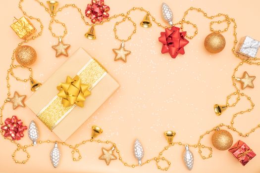gift box or present box with golden star, bell and ball on golden background for birthday, christmas or wedding ceremony