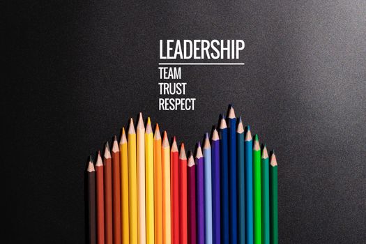 Leadership business concept. color pencil on black background