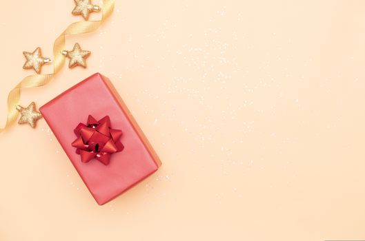 gifts box or presents box with red bows and star on golden background for birthday, christmas or wedding ceremony