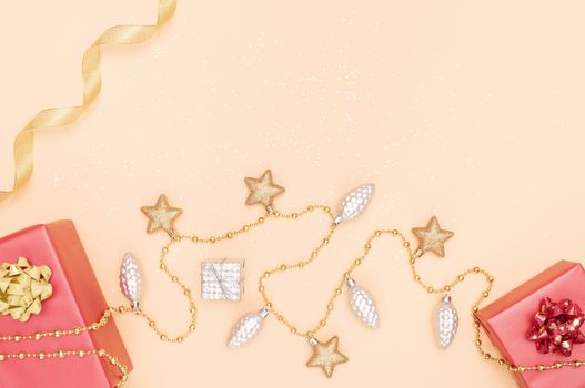 gifts boxes or presents boxes with red bows, star and ball on golden background for birthday, christmas or wedding ceremony