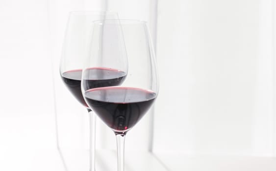 Two crystal glasses of red wine, organic beverage product