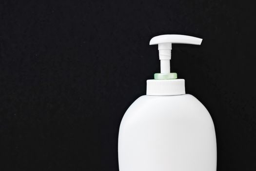 Blank label cosmetic container bottle as product mockup on black background, hygiene and healthcare