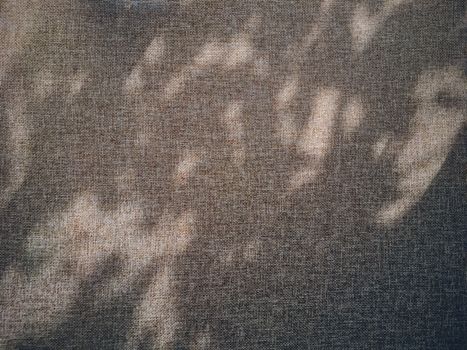Linen texture and shadows as rustic background, fabric and material