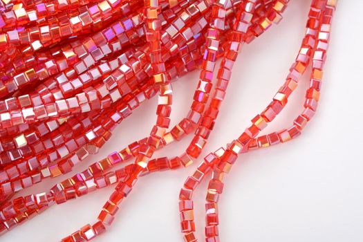 Beautiful Red Glass Sparkle Crystal Isoalted Beads on white background. Use for diy beaded jewelry