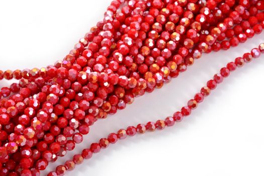 Beautiful Red Glass Sparkle Crystal Isoalted Beads on white background. Use for diy beaded jewelry