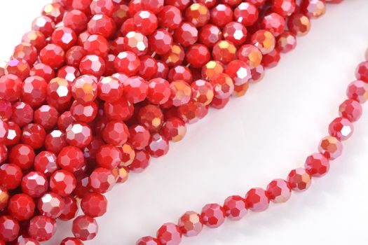 Beautiful Red Glass Sparkle Crystal Isoalted Beads on white background. Use for diy beaded jewelry