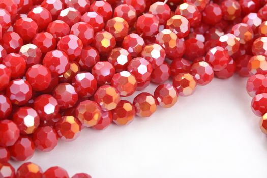 Beautiful Red Glass Sparkle Crystal Isoalted Beads on white background. Use for diy beaded jewelry