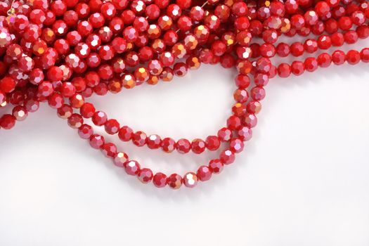 Beautiful Red Glass Sparkle Crystal Isoalted Beads on white background. Use for diy beaded jewelry