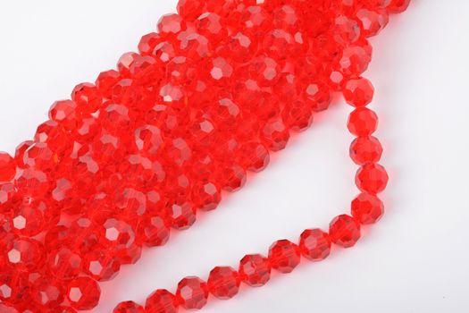 Beautiful Red Glass Sparkle Crystal Isoalted Beads on white background. Use for diy beaded jewelry