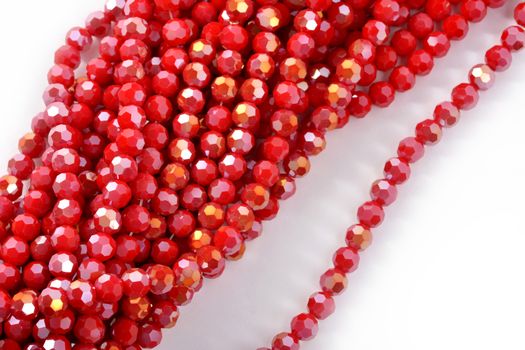 Beautiful Red Glass Sparkle Crystal Isoalted Beads on white background. Use for diy beaded jewelry