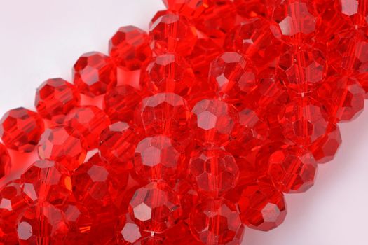 Beautiful Red Glass Sparkle Crystal Isoalted Beads on white background. Use for diy beaded jewelry