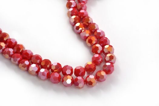 Beautiful Red Glass Sparkle Crystal Isoalted Beads on white background. Use for diy beaded jewelry