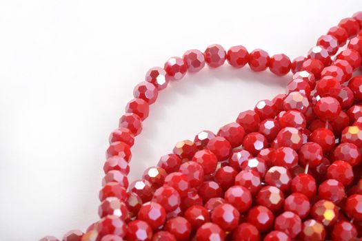 Beautiful Red Glass Sparkle Crystal Isoalted Beads on white background. Use for diy beaded jewelry