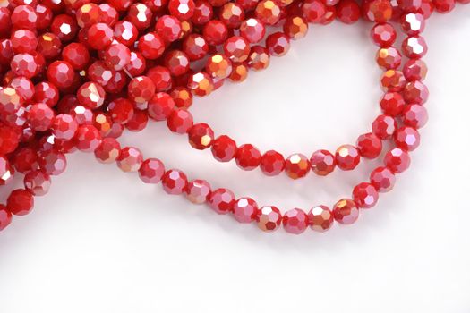 Beautiful Red Glass Sparkle Crystal Isoalted Beads on white background. Use for diy beaded jewelry