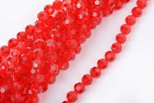 Beautiful Red Glass Sparkle Crystal Isoalted Beads on white background. Use for diy beaded jewelry
