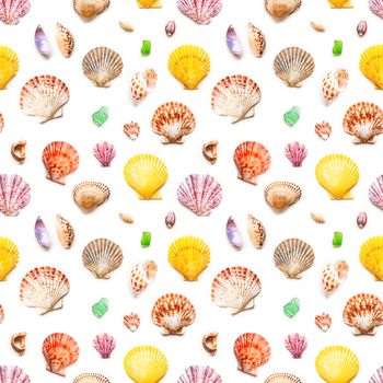 Seamless photo pattern with different sea shells. Flat lay with colorful mollusc shells, corals and wave-worn pieces of glass and stones. Top view on finds from ocean beach.