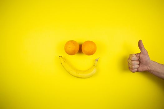 banana and oranges in the form of a smile, fruits