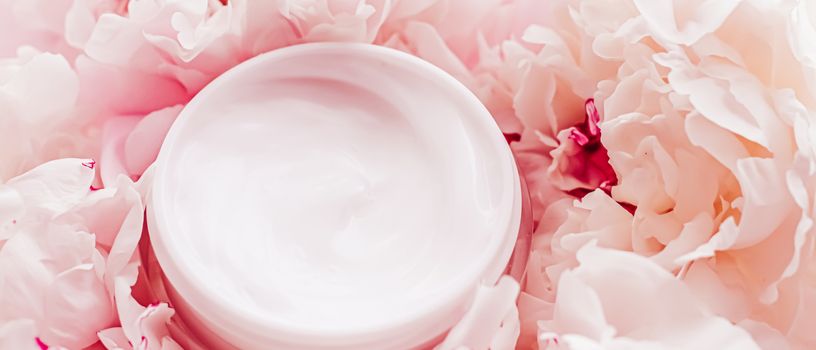 Luxe cosmetic cream jar as antiaging skincare routine product on background of peony flowers, body moisturizer and beauty branding design