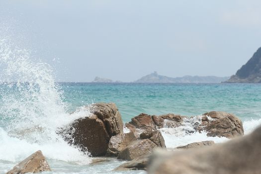 Sardinian rocky and natural beach landscape during a summer day