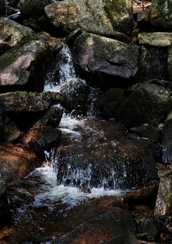 Close-up of some rocks and a small waterfall