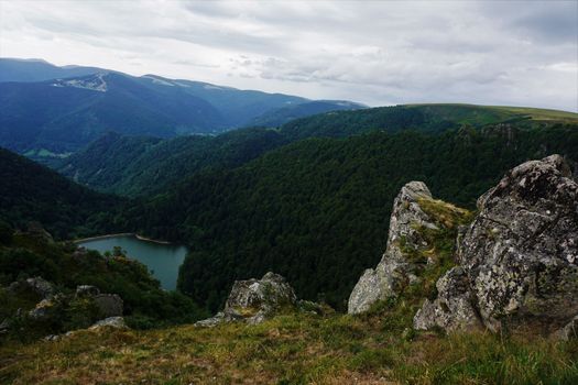 Top view on lake Schiessrothried with hilly landscape of the Vosges, France
