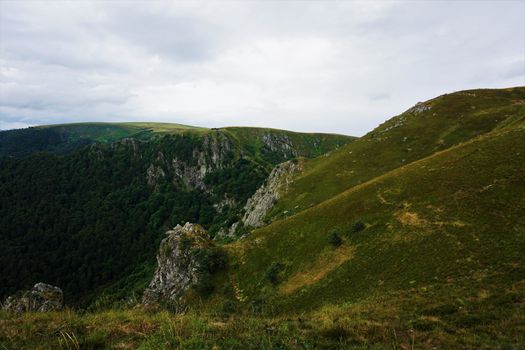 View over the flank of Le Hohneck mountain over dramatic landscape in the Vosges, France