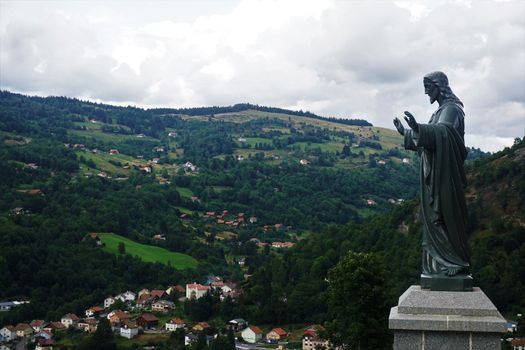 Huge statue of Jesus blessing the village La Bresse, France