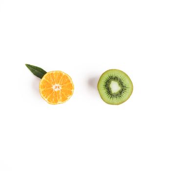 Food and fruit concept - cut of mandarine and kiwi. Top view or flat-lay. Copy space. Isolated on white with clipping path. Isolated on white with clipping path.