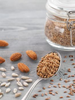 Homemade LSA mix in spoon - Linseed or flax seeds, Sunflower seeds and Almonds. Traditional Australian blend of ground, source of dietary fiber, protein, omega fatty acids. Copy space for text.