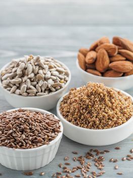 Homemade LSA mix in plate and Linseed or flax seeds, Sunflower seeds and Almonds. Traditional Australian blend of ground, source of dietary fiber, protein, omega fatty acids. Copy space for text.