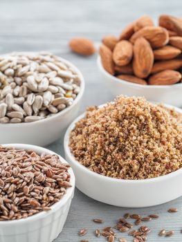 Homemade LSA mix in plate and Linseed or flax seeds, Sunflower seeds and Almonds. Traditional Australian blend of ground, source of dietary fiber, protein, omega fatty acids. Copy space for text.