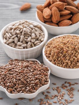 Homemade LSA mix in plate and Linseed or flax seeds, Sunflower seeds and Almonds. Traditional Australian blend of ground, source of dietary fiber, protein, omega fatty acids. Copy space for text.