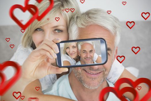 Composite of Couple taking Valentines selfie