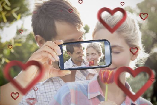 Composite of Couple taking Valentines selfie
