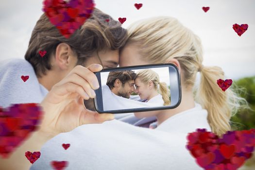 Composite of Couple taking Valentines selfie