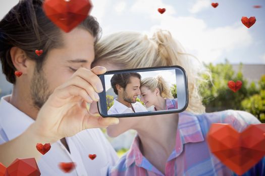 Composite of Couple taking Valentines selfie