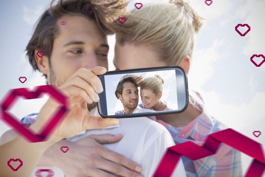 Composite of Couple taking Valentines selfie