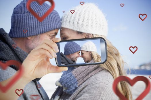 Composite of Couple taking Valentines selfie