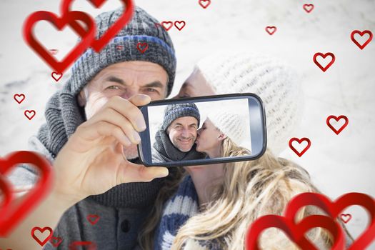 Composite of Couple taking Valentines selfie