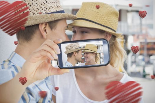 Composite of Couple taking Valentines selfie