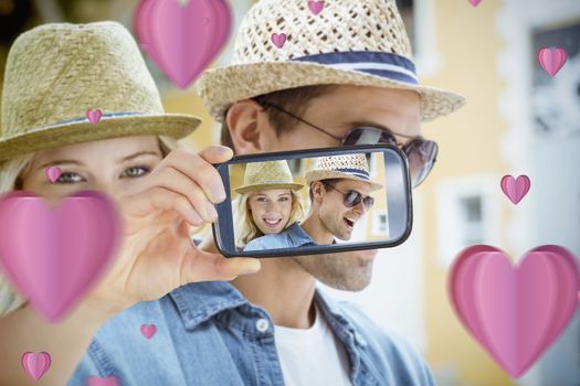 Composite of Couple taking Valentines selfie