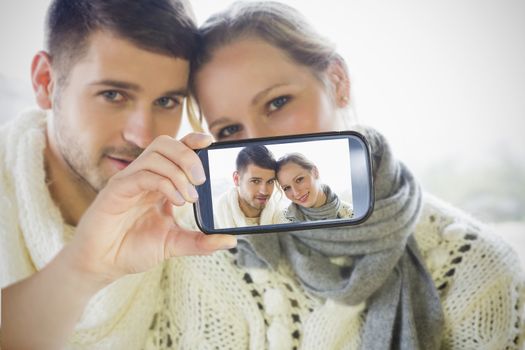 Composite of Couple taking selfie on smartphone