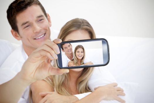 Composite of Couple taking selfie on smartphone